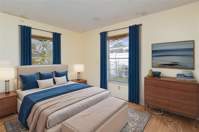 bedroom with light hardwood / wood-style flooring