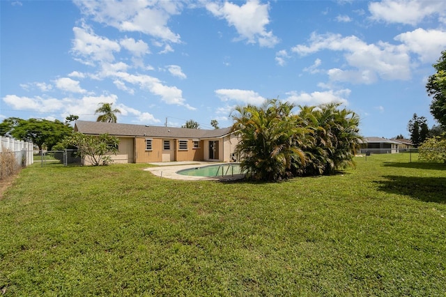 view of yard featuring a fenced in pool and a patio