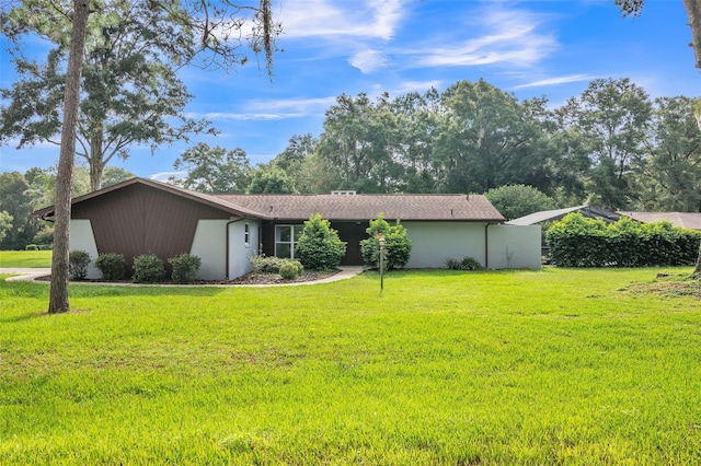 ranch-style home with a front yard