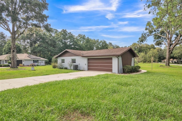 exterior space with a front yard and a garage