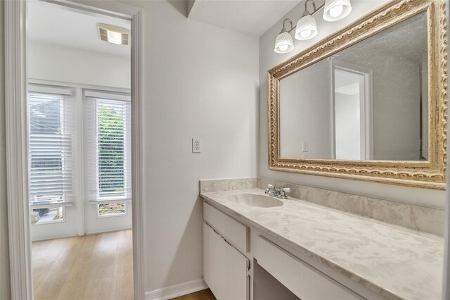 bathroom with wood-type flooring and vanity