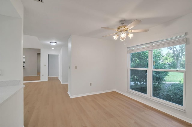 unfurnished room featuring light hardwood / wood-style floors and ceiling fan