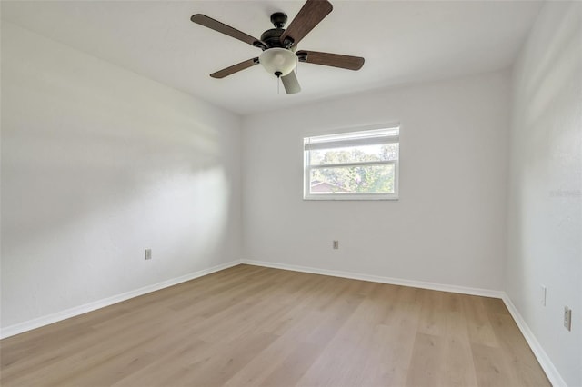 unfurnished room featuring light wood-type flooring and ceiling fan