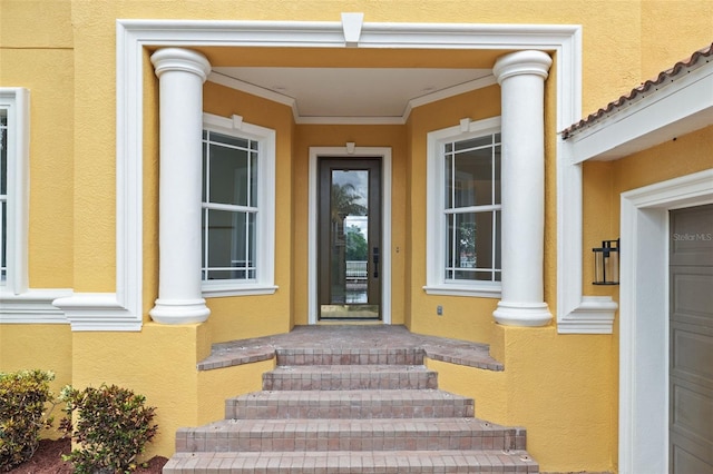 property entrance with a garage