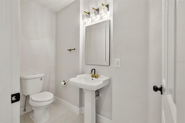 bathroom with sink and toilet