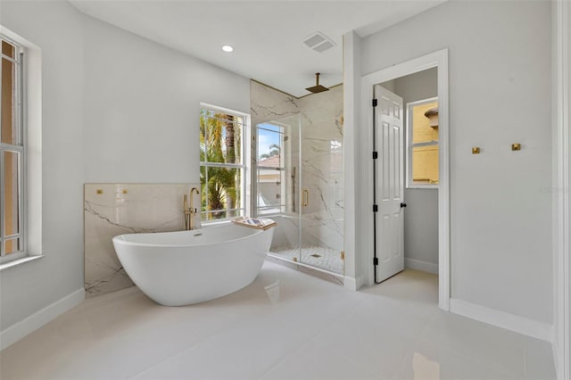 bathroom featuring shower with separate bathtub and tile patterned floors