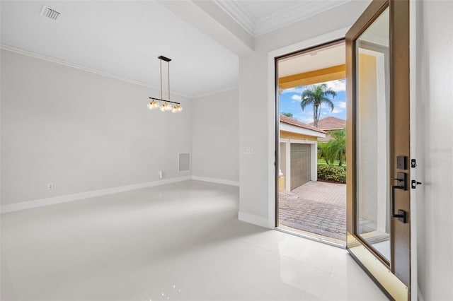 tiled entrance foyer with a notable chandelier and crown molding