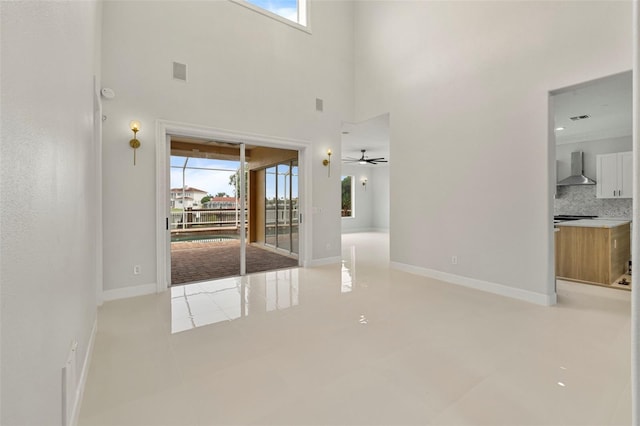 interior space featuring visible vents, plenty of natural light, and baseboards