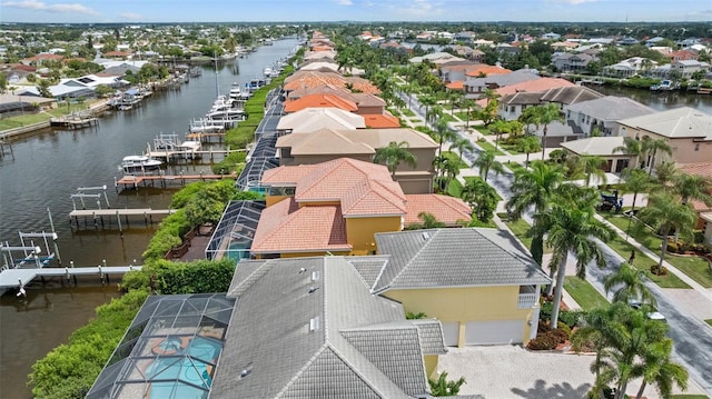 bird's eye view featuring a residential view and a water view