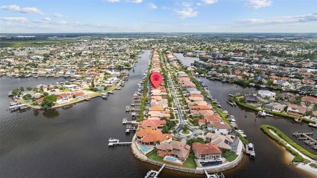 birds eye view of property featuring a water view and a residential view