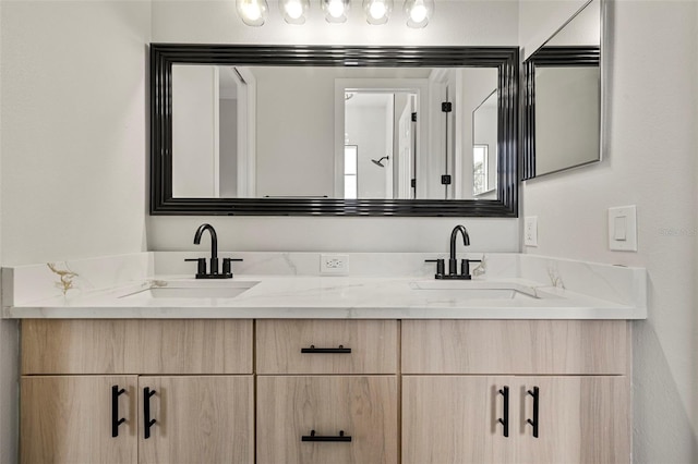 full bath with double vanity and a sink