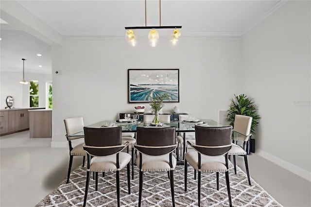 dining room featuring crown molding, baseboards, recessed lighting, and a chandelier