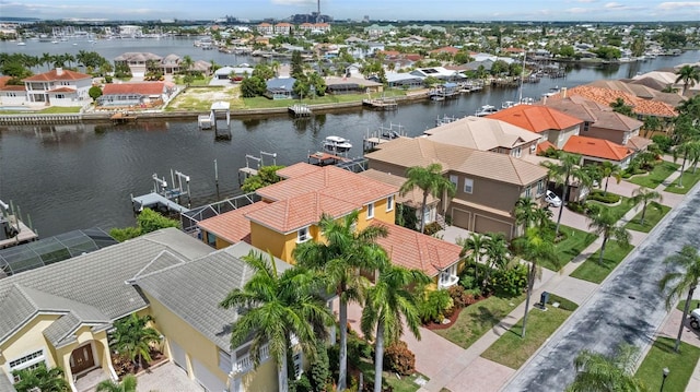 aerial view of residential area with a nearby body of water