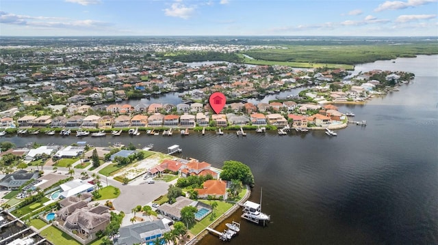 aerial view of residential area featuring a large body of water