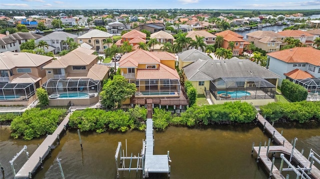 aerial perspective of suburban area with a nearby body of water