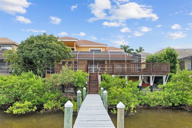 1233 Acappella Ln, Apollo Beach, FL 33572 - back of property featuring stucco siding, a tiled roof, stairway, and a deck with water view
