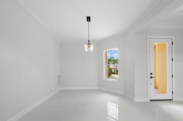 1233 Acappella Ln, Apollo Beach, FL 33572 - spare room featuring ornamental molding and a chandelier