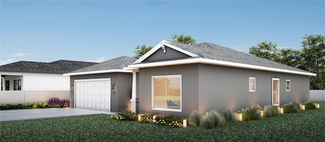 view of front facade featuring a garage and a front yard