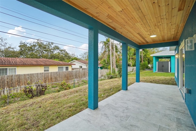 view of patio featuring fence