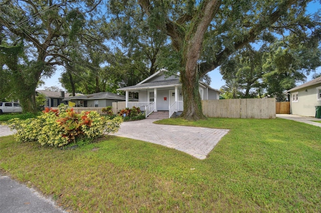 view of front facade featuring a front yard and a porch