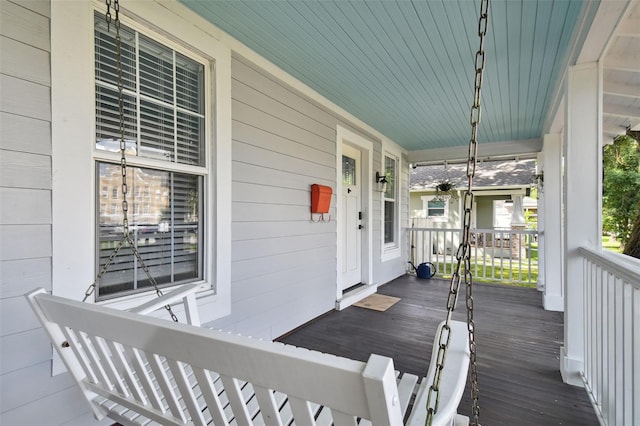 wooden terrace with a porch