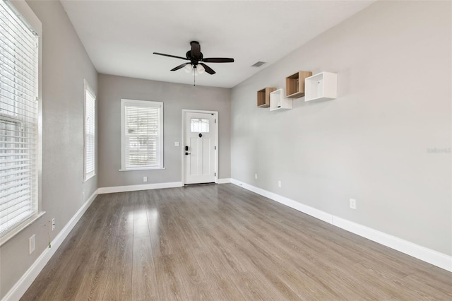 foyer entrance featuring light hardwood / wood-style floors and ceiling fan