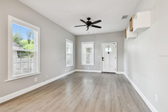 entryway with ceiling fan, light hardwood / wood-style floors, and a healthy amount of sunlight