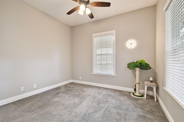 unfurnished room featuring carpet, ceiling fan, and a healthy amount of sunlight