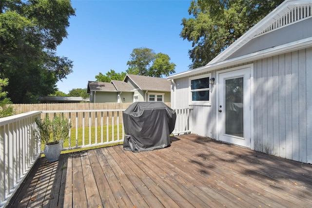 wooden terrace featuring grilling area