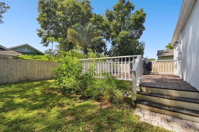 view of yard featuring a wooden deck