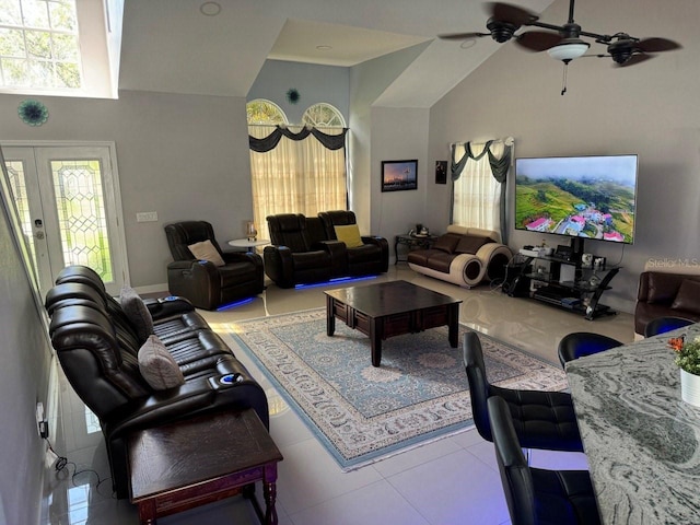 living room with ceiling fan, french doors, and high vaulted ceiling