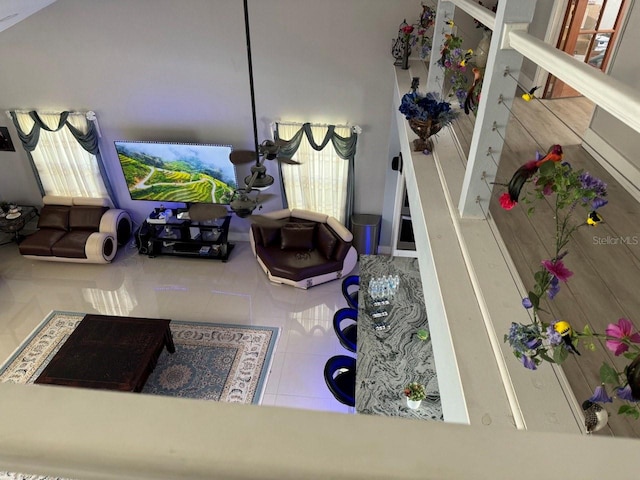 living room with tile patterned floors and a healthy amount of sunlight