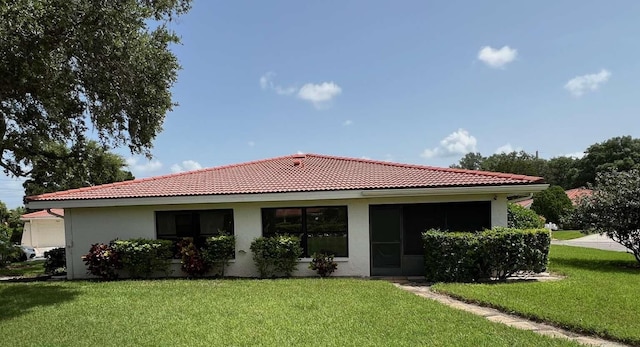 exterior space with a front lawn