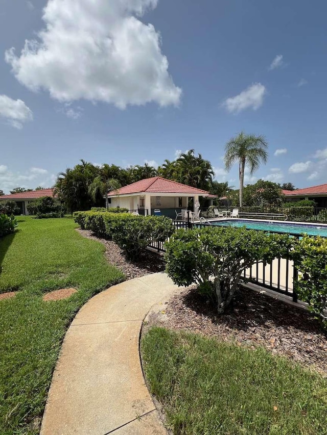 view of yard featuring a community pool