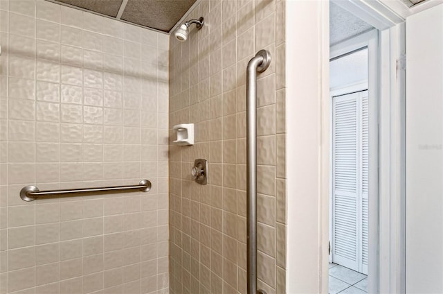 bathroom with a tile shower