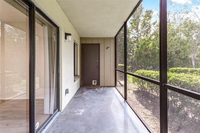 unfurnished sunroom featuring plenty of natural light