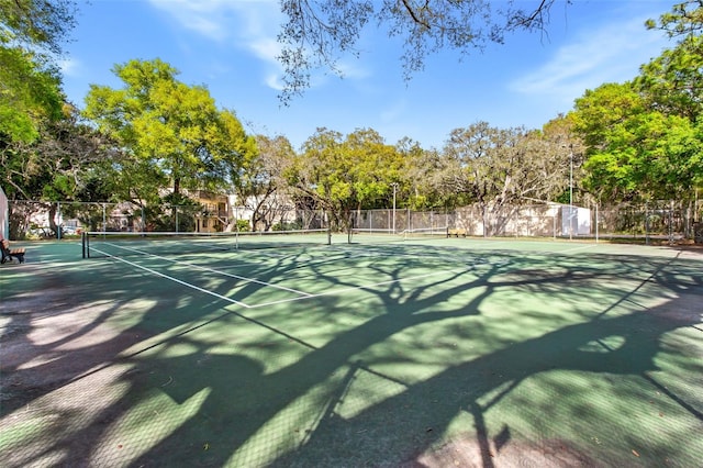 view of sport court featuring fence