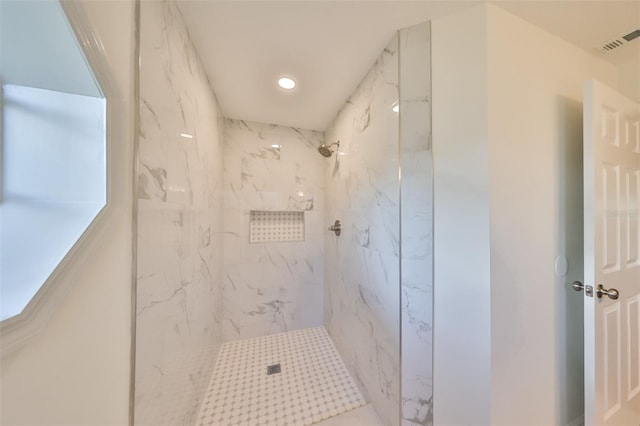 bathroom featuring tiled shower