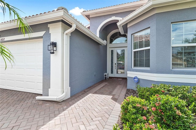 property entrance with a garage