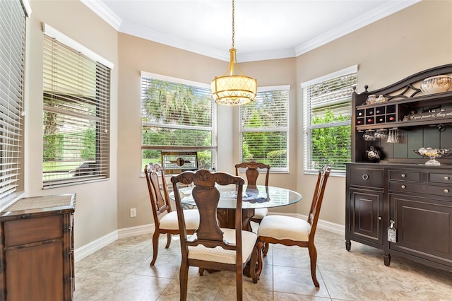 tiled dining space featuring crown molding and a chandelier