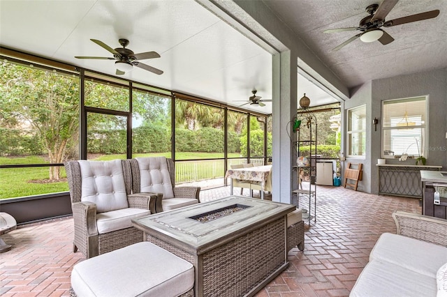 sunroom / solarium with ceiling fan and a wealth of natural light