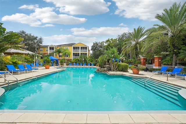 view of swimming pool featuring a patio area