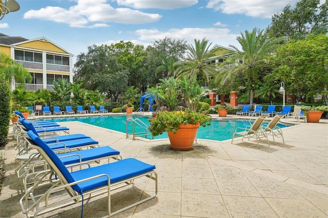 view of pool featuring a patio