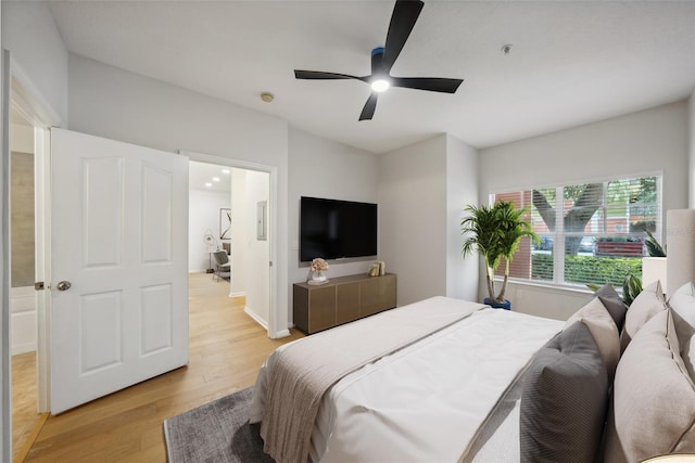 bedroom with light wood finished floors and ceiling fan