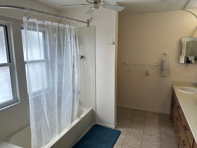 bathroom with vanity, a textured ceiling, shower / bath combo, and tile patterned flooring