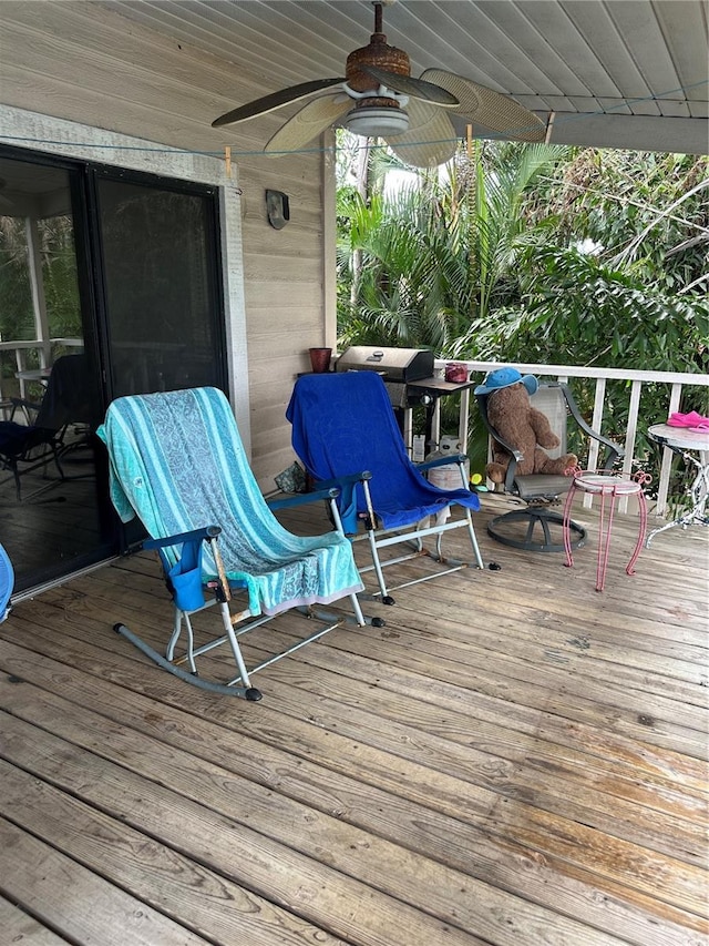 deck featuring grilling area and ceiling fan