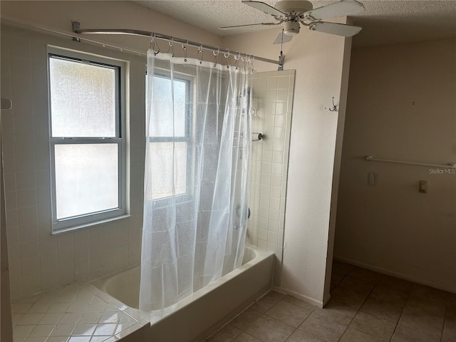 bathroom featuring ceiling fan, tile patterned floors, a textured ceiling, and shower / bath combo with shower curtain