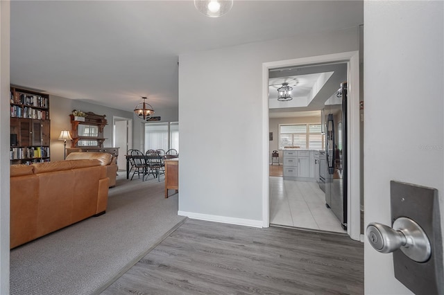 interior space featuring a notable chandelier and light hardwood / wood-style floors