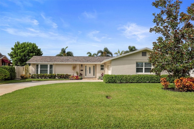 single story home featuring a front yard