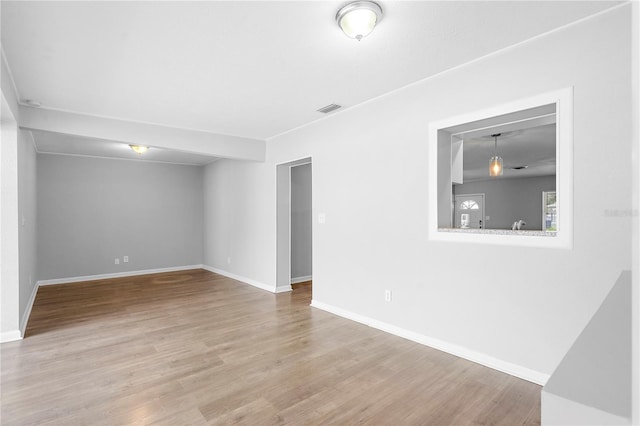 spare room with hardwood / wood-style flooring